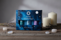 Coffret Sleep huiles essentielles posé sur fond bois ambiance nocturne apaisante